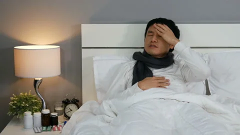 Sick man is headache in a bed Video stock 130724250