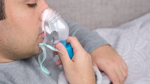 Sick man inhaler Stock Footage 295120095