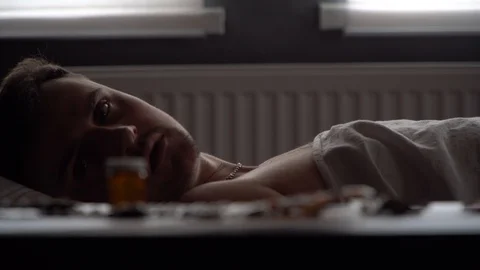 Sick man looking for the right medication Stock Footage 125809940
