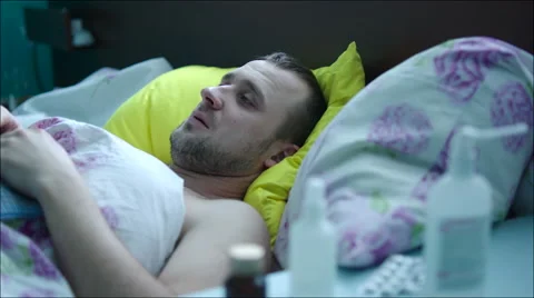 Sick Man Lying in Bed Video stock 60378410