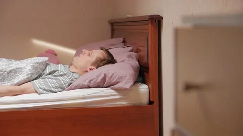 Sick Man Lying On The Bed Stock Footage 153329392