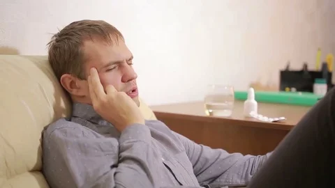 Sick man lying in bed suffering virus having medicine tablets. drinking pill Stock Footage 69184323