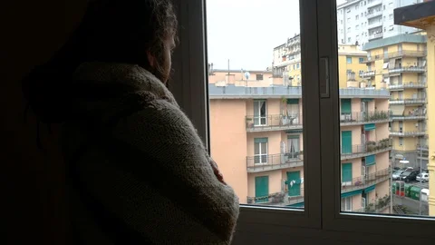 A sick man sneezing in front of the window Stock Footage 86512060
