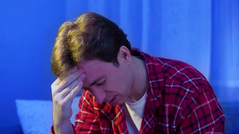 Sick man suffering from a headache and flu symptoms. Concept of a seasonal cold, Stock Footage 342053530