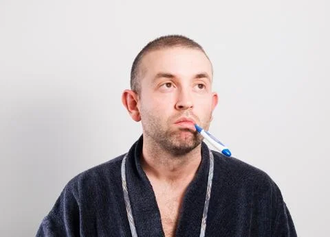 Sick man with a thermometer Stock Photos