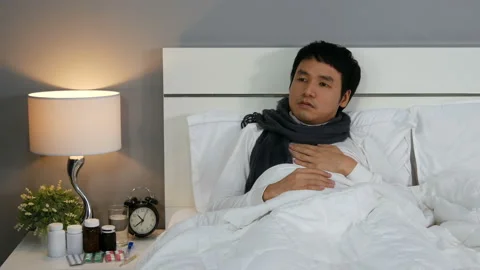 Sick man tired in a bed Stock Footage 130723053