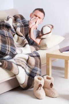 Sick man with tissue Stock Photos