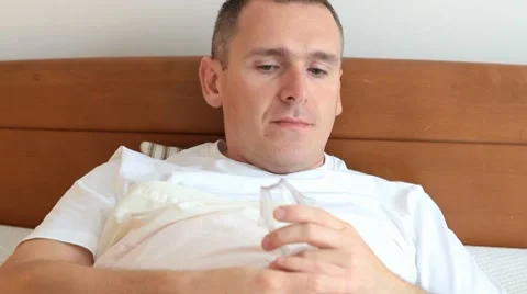 Sick man using inhaler also called nebulizer Stockbeeldmateriaal 7902872