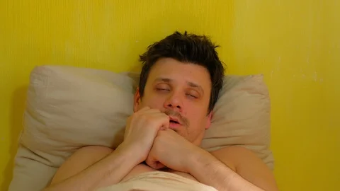Sick man waking up with headache, sars, cold, coronavirus, portrait closeup. Stock Footage 128959046