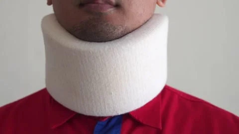 A sick Man Wearing a Cervical Collar to fix a neck fracture. Stock Footage 328646395