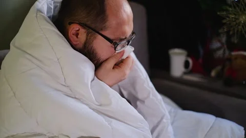 Sick man wrapped with blanket during covid outbreak. Stock Footage 145915902