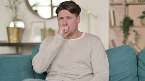Sick Middle Aged Man Coughing, at Home Stock Footage 142375404