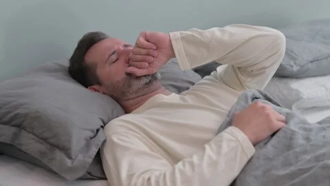 Sick Middle Aged Man Coughing while Sleeping in Bed Stock-Footage 287899212