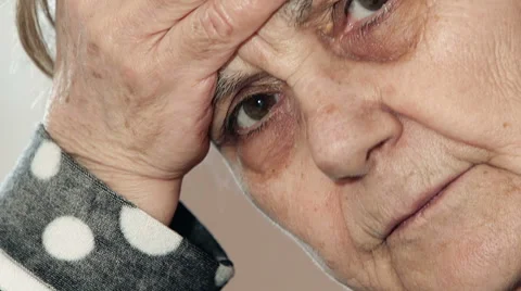 Sick old lady looks to the camera Stock Footage 63420593