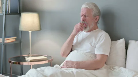 Sick Old Man Coughing in Bed Stock Footage 143241288