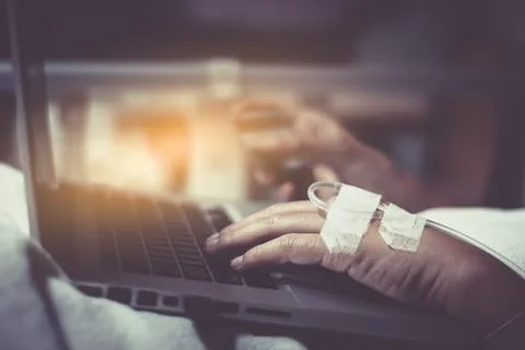 Sick people are using notebook for pay bill by credit card , or registering c Stock Photos