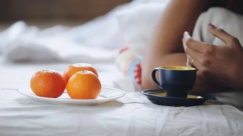 Sick person is ill, drinking cup of tea in bed at home Stock Footage