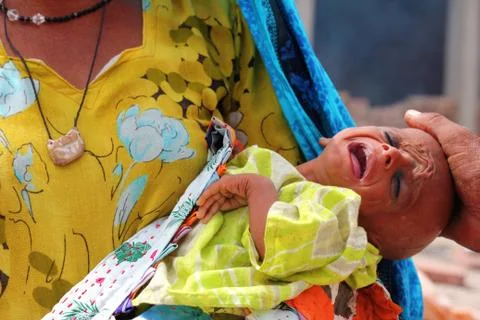 Sick Refugee Baby Crying in Shikarpur, Pakistan Stock Photos
