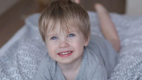 Sick two years old child boy on the bed at home - coughing Stock Footage 93863982
