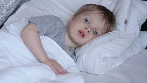 Sick two years old child boy on the bed at home - coughing Stock Footage 93864201