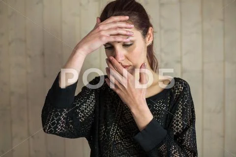 Sick Woman With Hand On Head