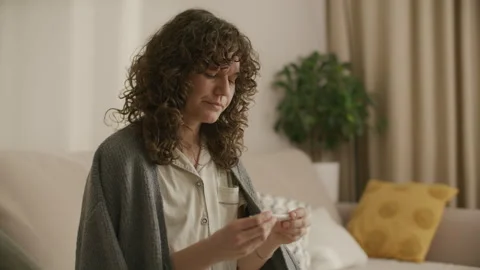 Sick Woman Taking Temperature with Thermometer and Coughing Видео 328356547