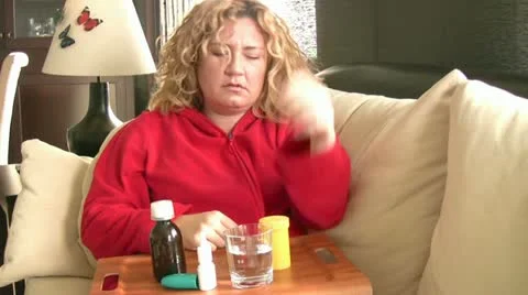 Sick women taking her pills Stock Footage
