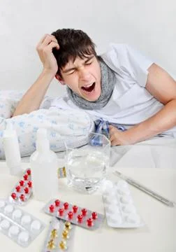 Sick Young Man with Flu Stock Photos