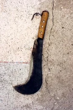 Sickle on a wall Stock Photos