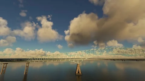 Side aerial drone sunset view of the Francis Scott Key Bridge in Maryland Stock Footage 270151674