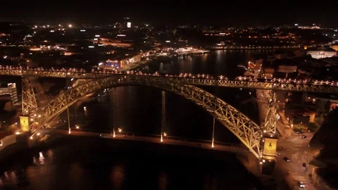 Side Aerial Pass Beside Dom Luis I Bridge at Night Stock Footage 344798718