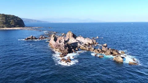 Side Aerial View of Rugged Volcanic Rocks Manazuru Stock Footage 329059430