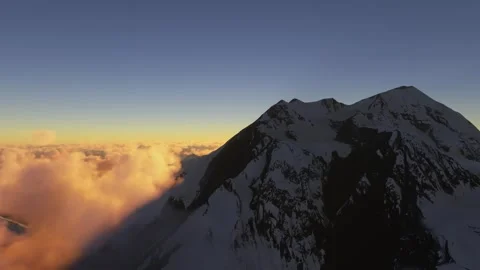 Side aerial view at sunset of Denali National Park and Preserve in Alaska Video stock 249453799