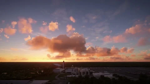 Side aerial view at sunset of Kennedy Space Center Visitor Complex, Florida Stock Footage 217437159