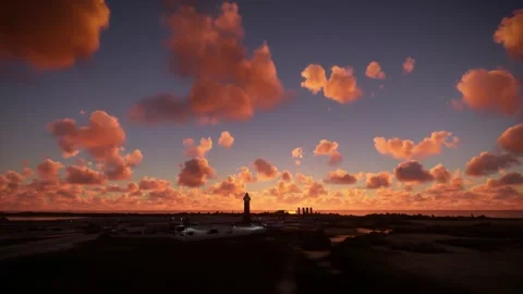 Side aerial view at sunset of the Space Rocket Launch Site in Boca Chica, Texas Video stock 217437360