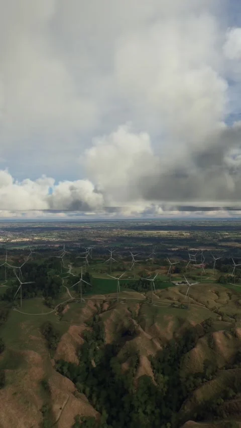 Side aerial view of the Tararua Wind Farm on the North Island in New Zealand Stock-Footage 284885253