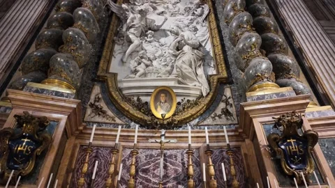 A side altar inside the Church of the Gesu in Rome Stock Footage 326503511