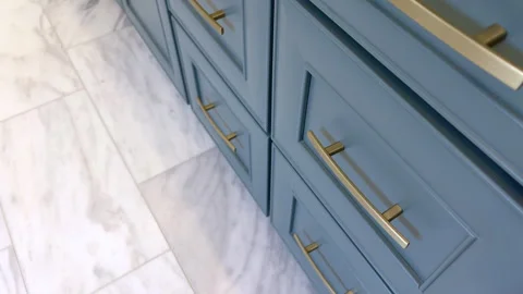 Side angle of blue vanity cabinetry Stock Footage 324510684