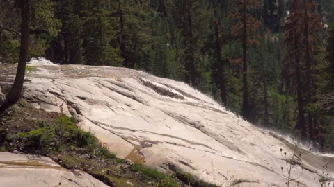 Side Angle of a Granite Waterfall Stock Footage 251361405