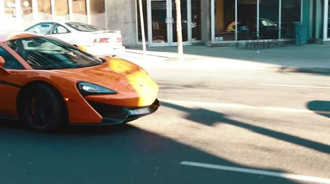 Side angle of orange mclaren Stock Footage 58948781