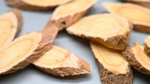 Side angle pan view herb HuangQi or Astragali Radix or Mongolian Milkvetch Ro Stock Footage 146149743