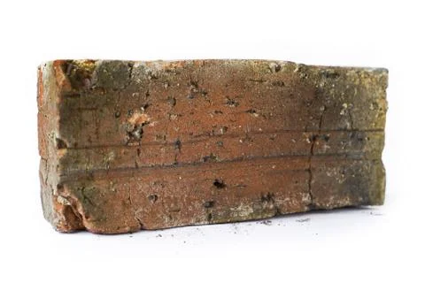 Side angle of red brick isolated on white background Fotos de archivo