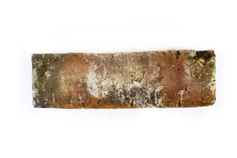 Side angle of red brick isolated on white background Foto stock