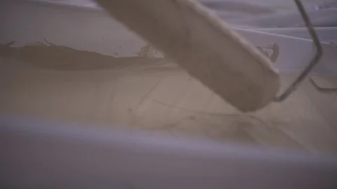 Side Angle Roll Paint Roller In Light Brown Paint Video stock 88013803