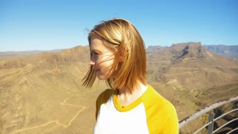 Side Angle Shot of Female Blonde Model Looking at the Valley Video stock 114325079