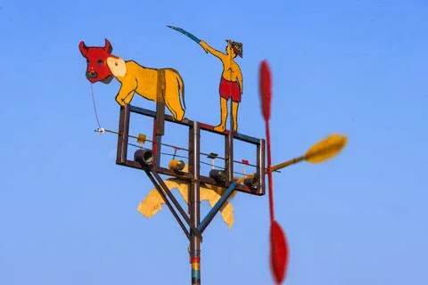 Side Angle View Of Farmer And Buffalo Wooden Windmill Spinning Propeller Bl.. Stock Photos