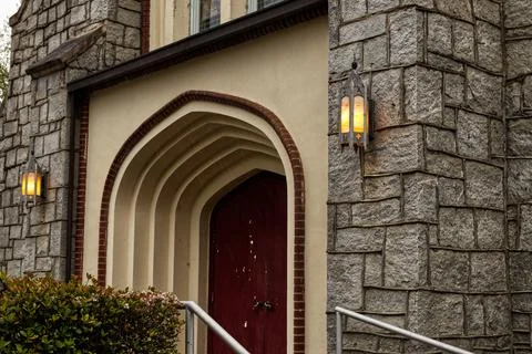 Side angle view Vintage old stone wall and gothic entrance Stock Photos