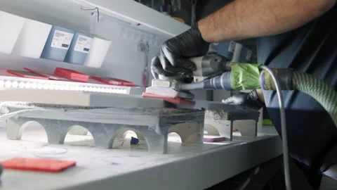Side angle worker sanding kitchen cabinetry Stock Footage 336576119