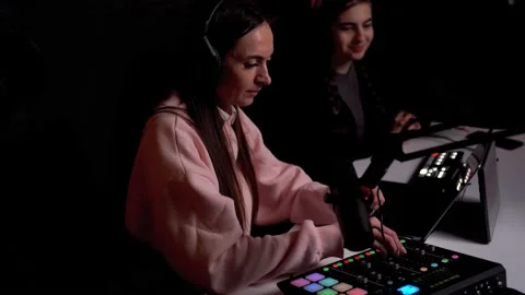 Side angle of young female podcaster and her guest Stock Footage 232662678