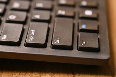 Side Angled Macro Close-Up Black Computer Keyboard Highlighting Shift Key o.. Stock Photos